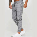 Cotton printed casual tapered trousers for men in black side view