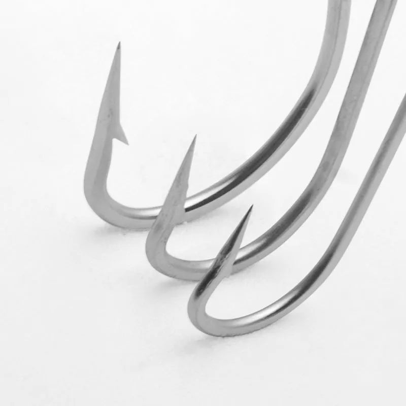 Assortment of multi-specification stainless steel alloy fishhooks for sea fishing.