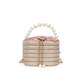 Women's black one-shoulder crossbody bag with pearl beading on the front.