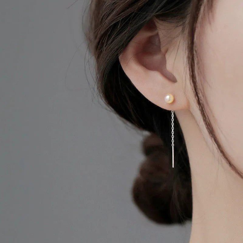 Sterling silver ear string earring with a selection of 5mm pendant charms including pearl, clay ball, and geometric shapes.