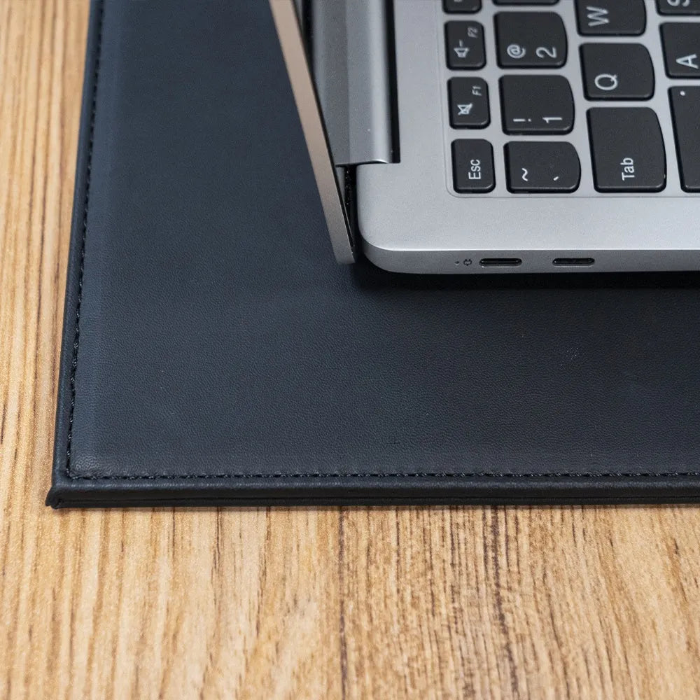 A3 sized anti-radiation printing pad in blue colour on a desk next to a printer.