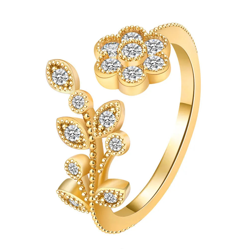 Open mouth floral ring with diamond-treated surface showing flower and leaf pattern in copper