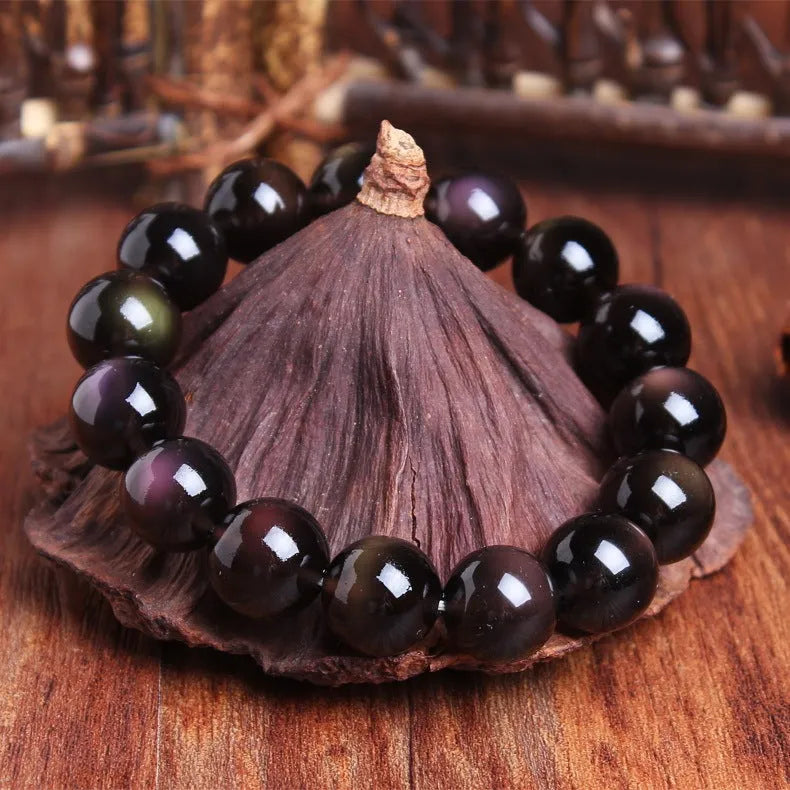 A polished crystal Pi Xiu bracelet with geometric beads on a wrist, shown in Ice Stone and Double Eye Ice Stone variants.
