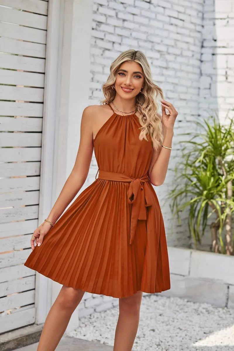 Women's black chiffon halter dress with pleated midi skirt and adjustable waist belt.