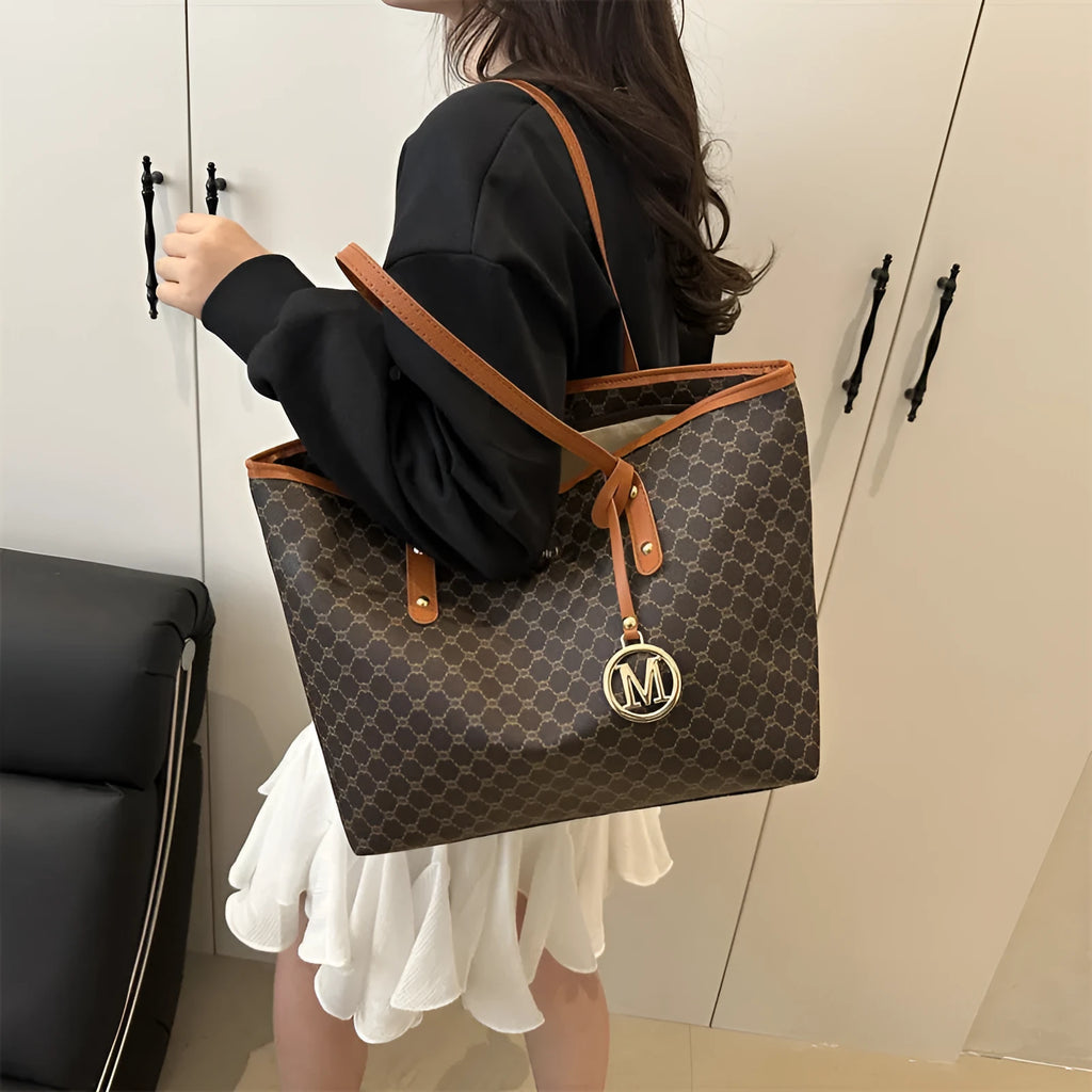 Structured PU shoulder bag in neutral colour with sewing thread detail and a long handle.