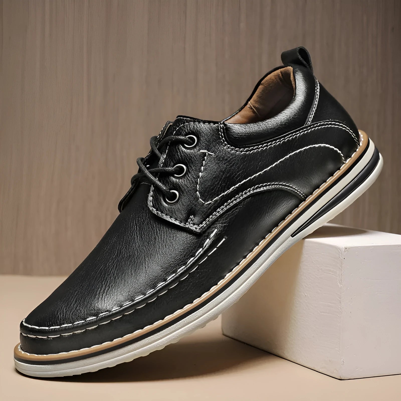 Men's genuine cowhide leather casual shoes in black with round toe and front lace-up design on a neutral background