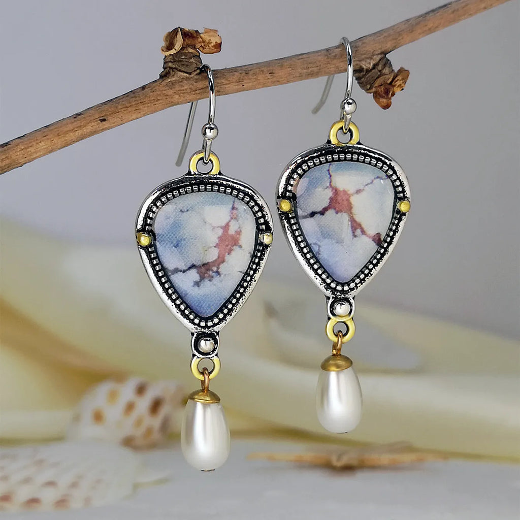 Retro blue Bohemian drop earrings with synthetic opal and pearl details on metal geometric setting