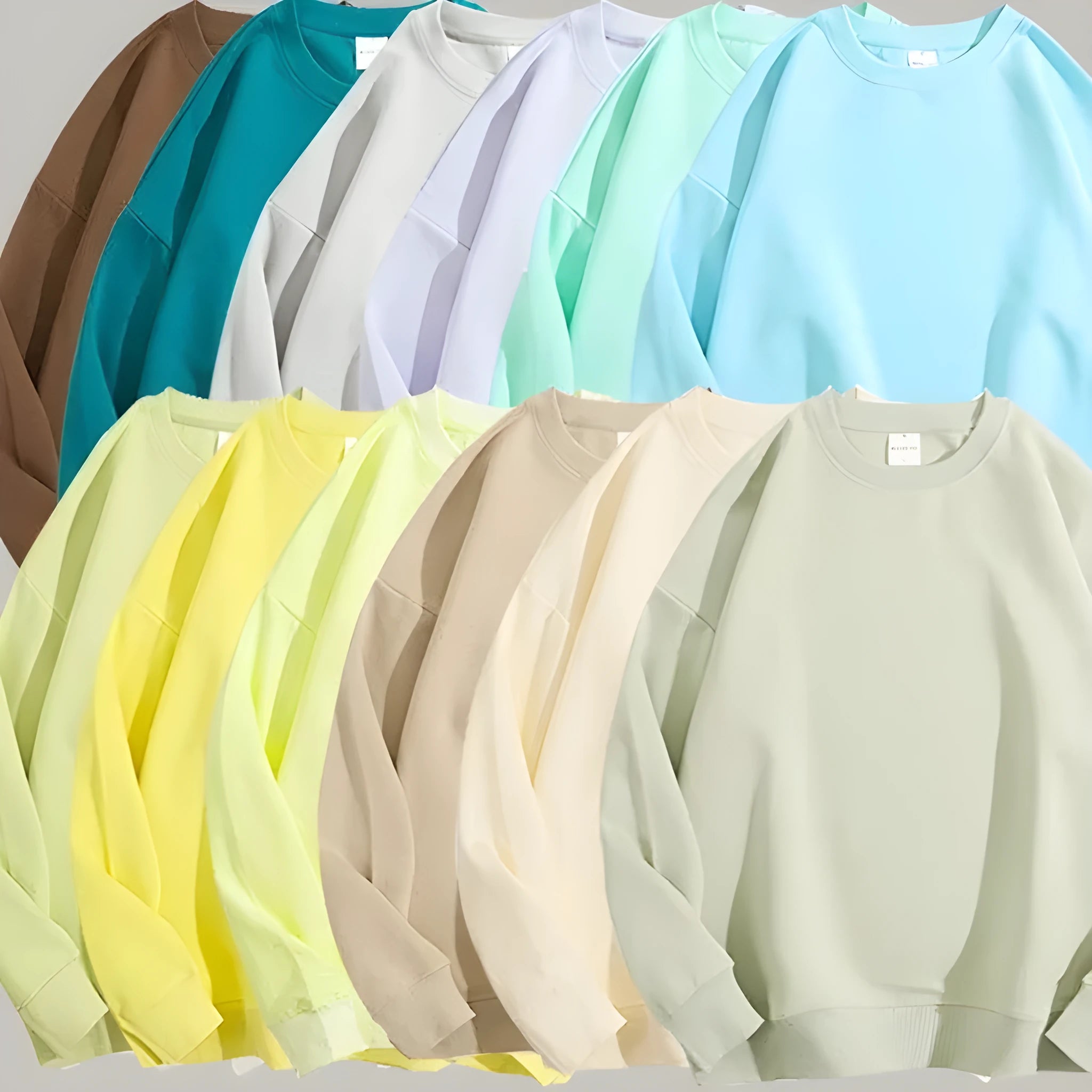 Cotton loose fit off shoulder pullover sweater in a selection of colours on a hanger