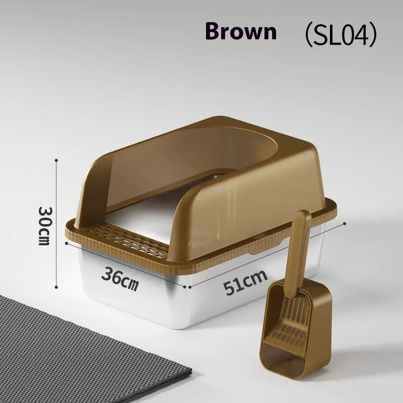 Dark gray stainless steel double-layer cat litter box with sand pad and scoop on a mat – medium size