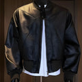 Black extended-length tight-fit PU leather jacket for men on a hanger.