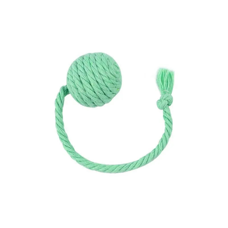 Green cat toy ball with attached rope and internal bell next to a pink one.