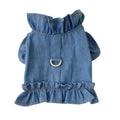 Blue denim dog dress with ruffles and a metal leash hook on the chest, shown on a small dog