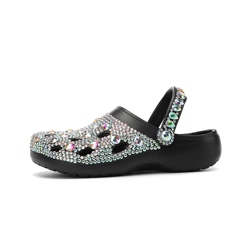 Black women's platform sandals with rhinestone detail and an open hole design on the EVA upper.