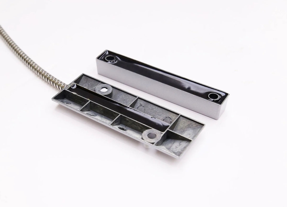 Wireless rolling shutter door magnetic smart detector in silver finish on a white background