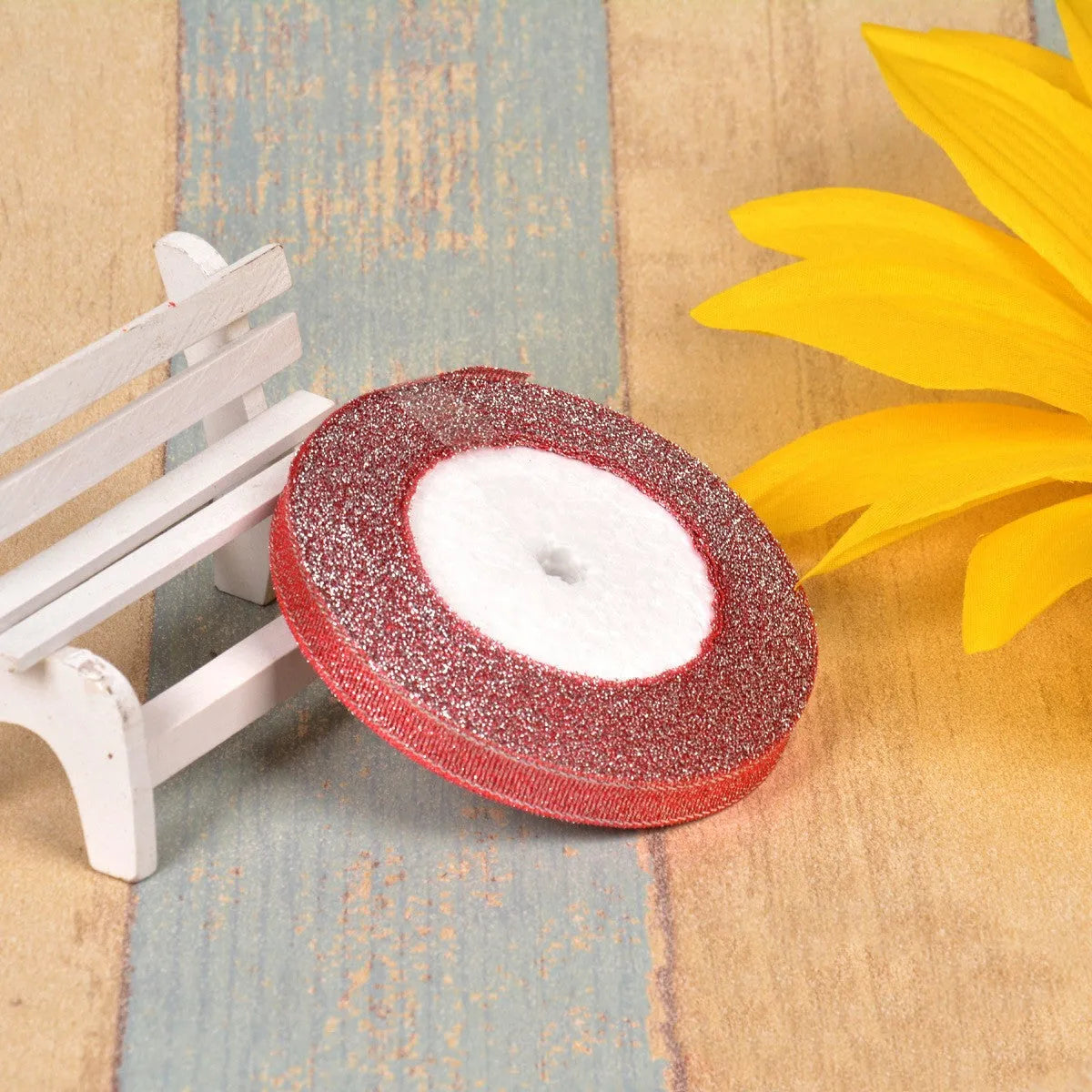 A roll of colourful green onion pattern polyester ribbon with metallic wire highlights, shown at 3-points width.