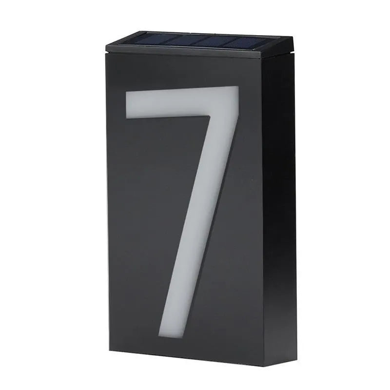 Solar powered white LED house number light with IP65 waterproof rating mounted on a wall.