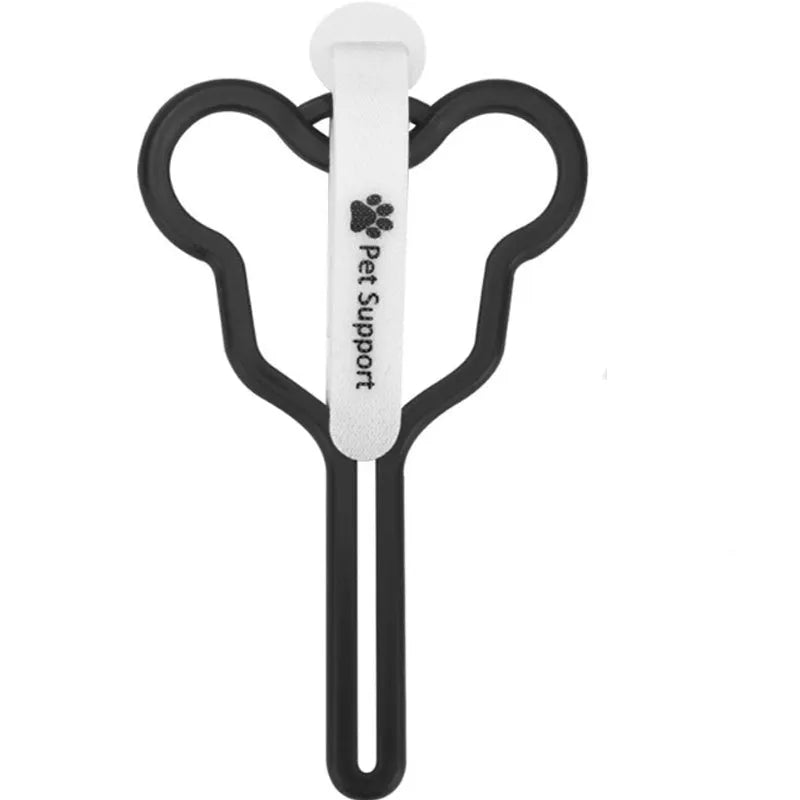 A hands-free dog poop bag holder with a fixed clip and adjustable black Velcro strap, shown attached to a dog lead.