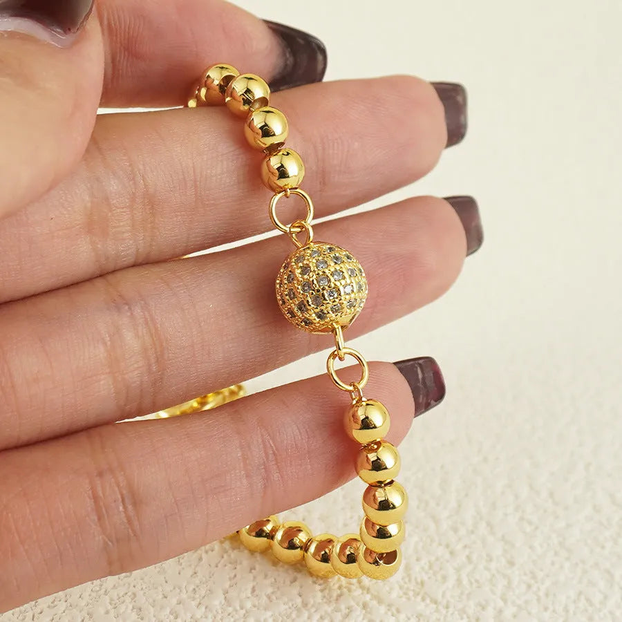 Arabic-style copper bracelet with a single zircon ball on a heart shape for women.