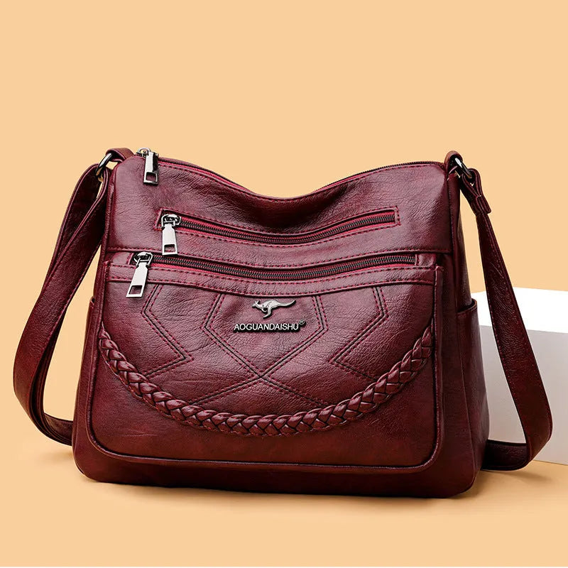 Soft leather shoulder bag in horizontal square shape with large capacity and internal zipper compartment