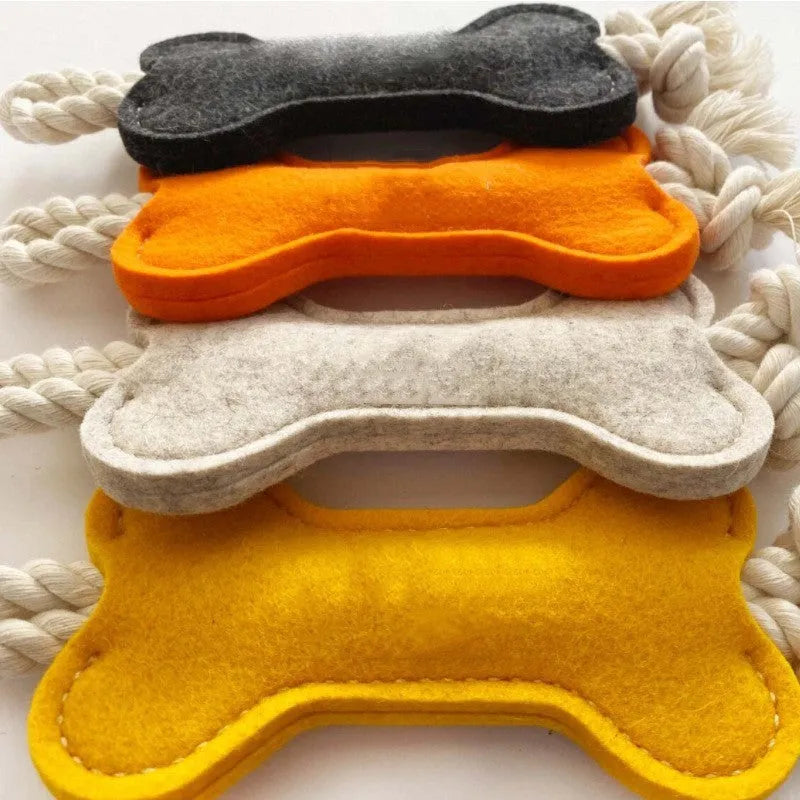Bone shaped dog rope toy with felt exterior in four colour options