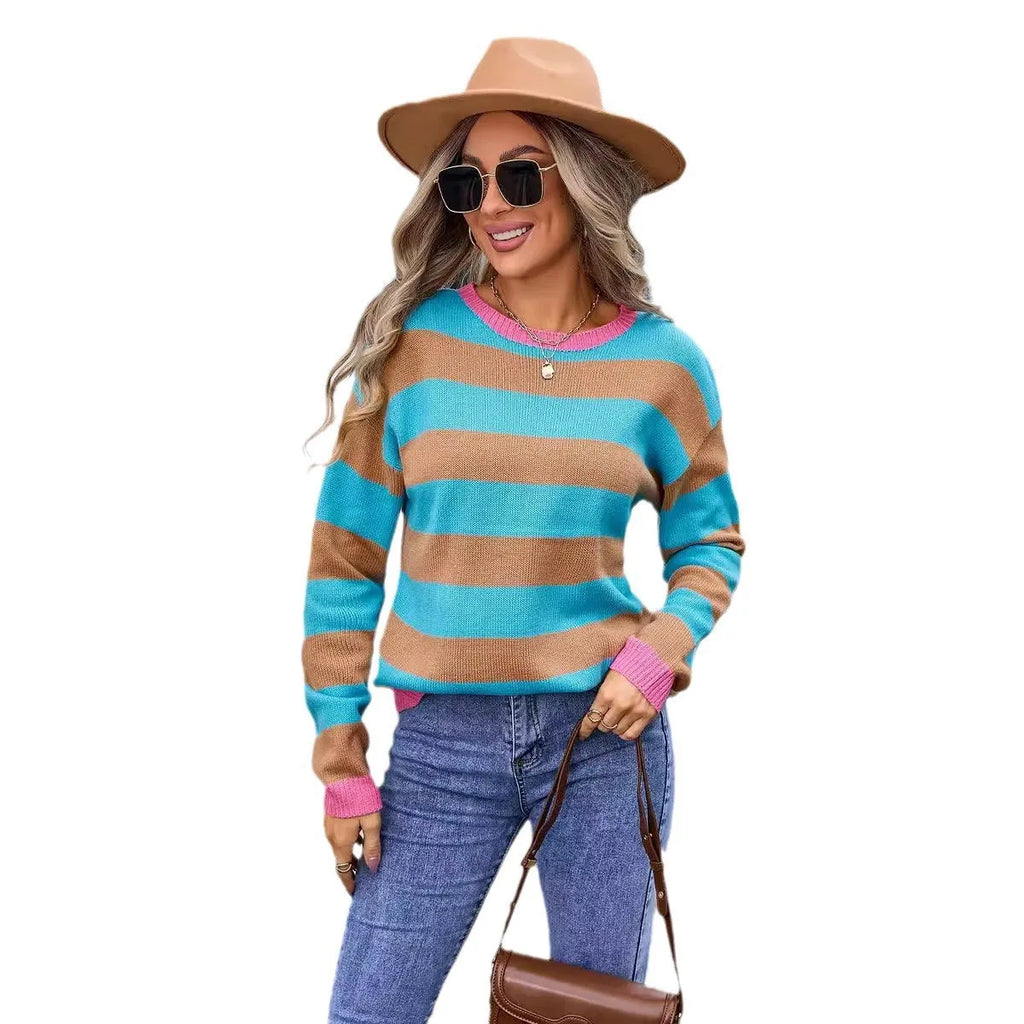 Women's loose fit long sleeve acrylic sweater in blue with a plaid pattern, featuring a round neck.