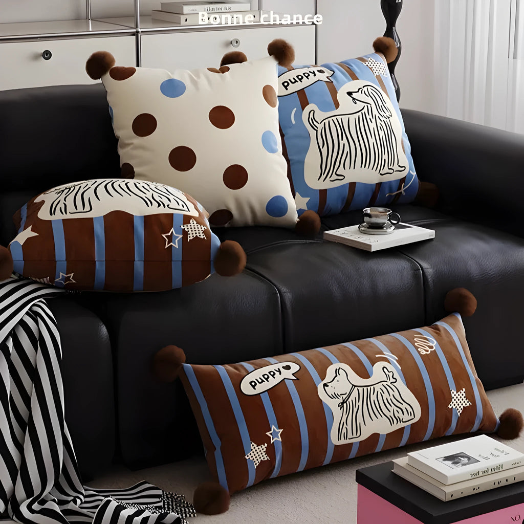 Blue cartoon anime print decorative sofa cushion pillow on a grey sofa.