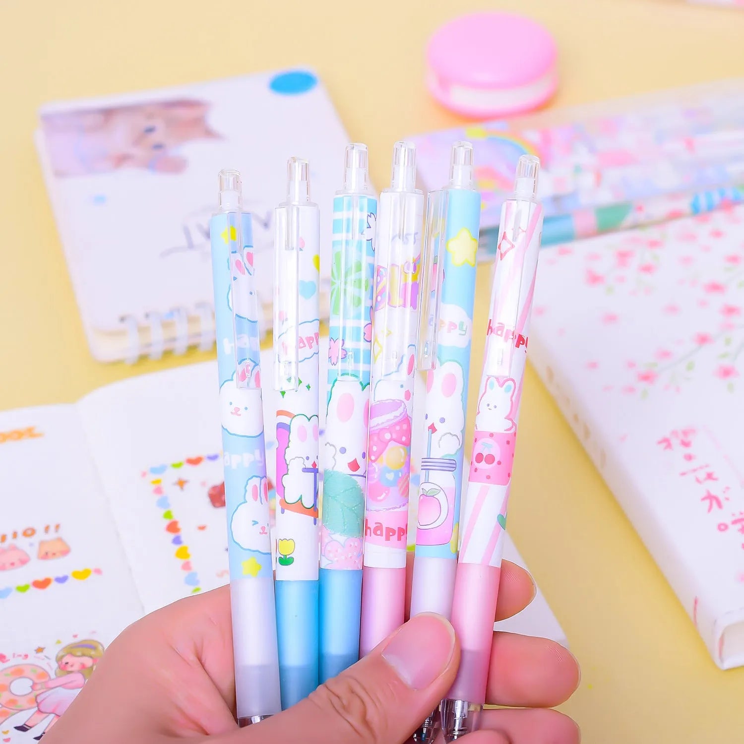 Six cartoon bunny decorated black ballpoint pens with 0.5mm tips on a white background.
