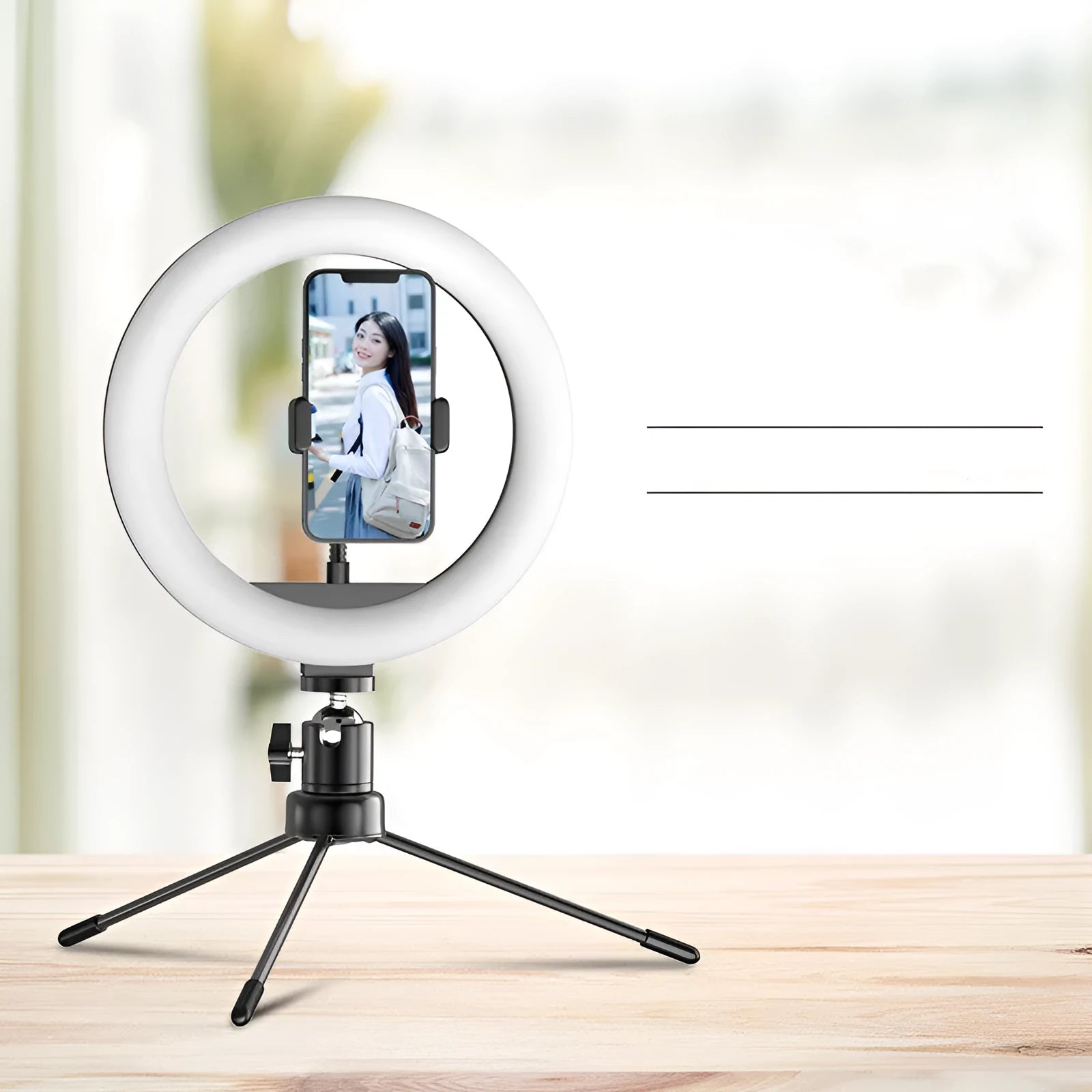 10 inch ring fill light desktop tripod stand with Bluetooth remote and phone holder on a table