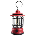 Dark green portable LED camping lantern with head strap, shown on a table with dimensions 16.6cm high.