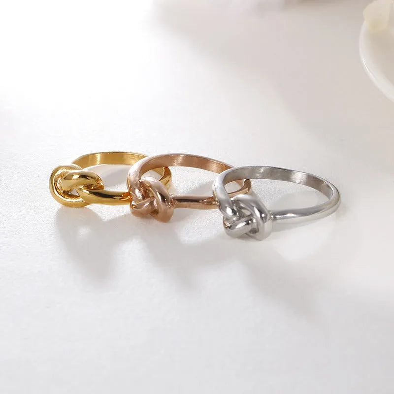 Truelove knot geometric titanium steel ring in gold KR82086-K on white background
