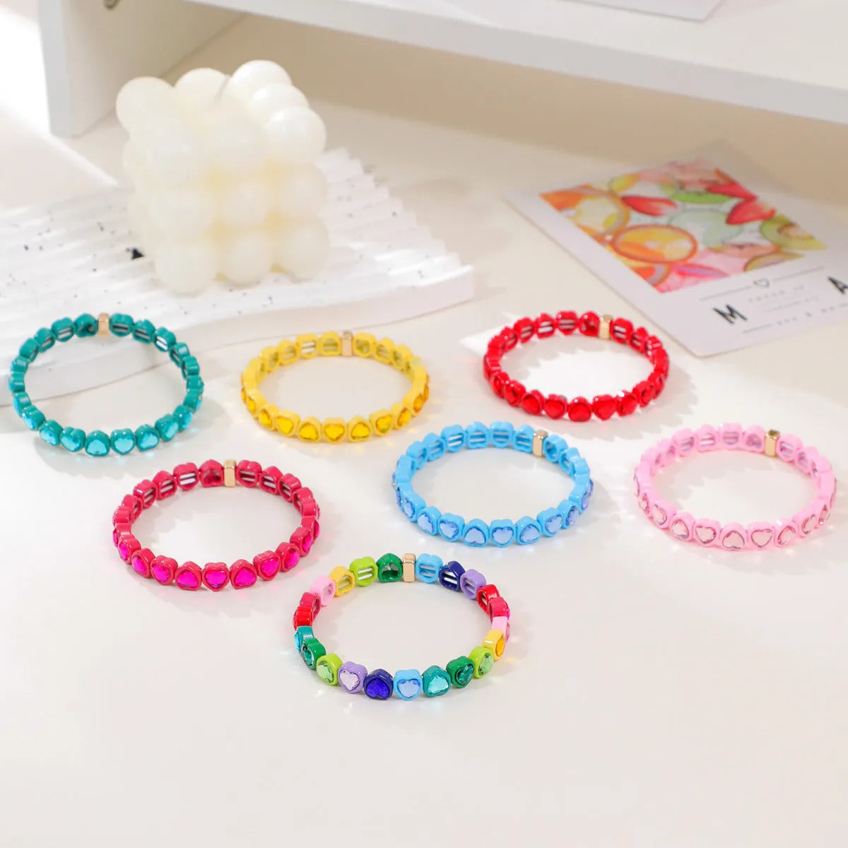 Rainbow enamel heart bracelet in alloy with colourful stretch band and unisex styling
