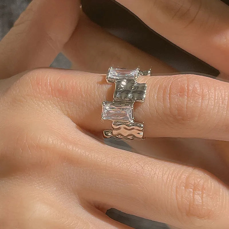 Silver open ring with cross zircon design and geometric retro styling
