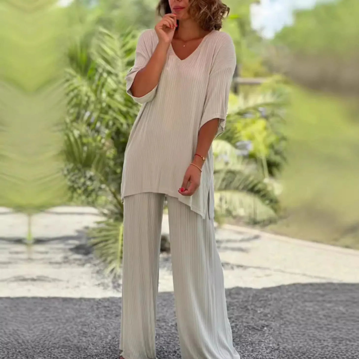 Women's two-piece knitwear set with long sleeve top and baggy straight trousers in black, grey, or beige, sizes S to 3XL
