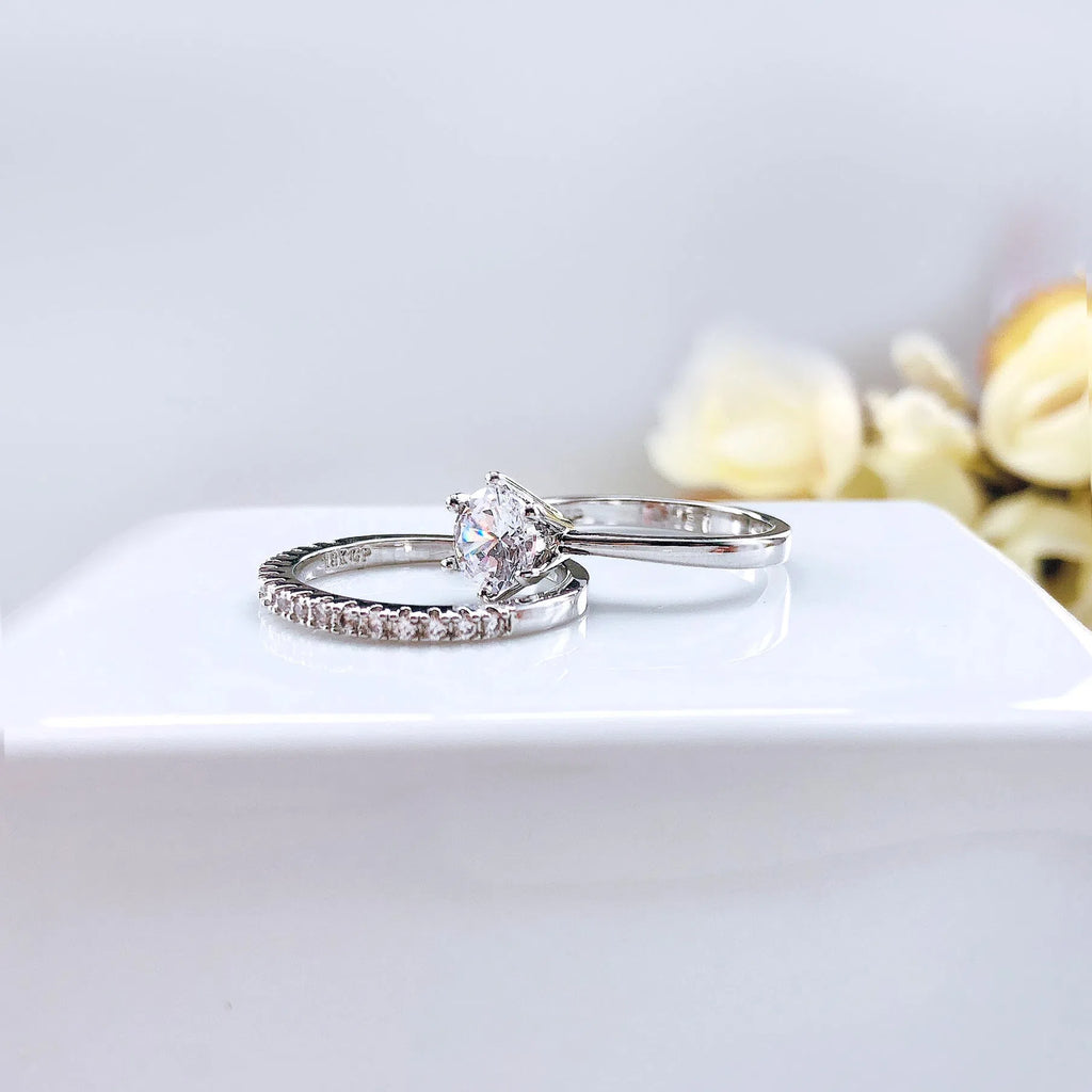 Gold plated copper ring set with two rings, each with a 6mm zircon stone in a six-claw setting, available in three colours.