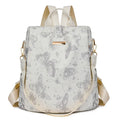 Butterfly print PU leather backpack in purple shown from the side, featuring sewing line details and shoulder straps.
