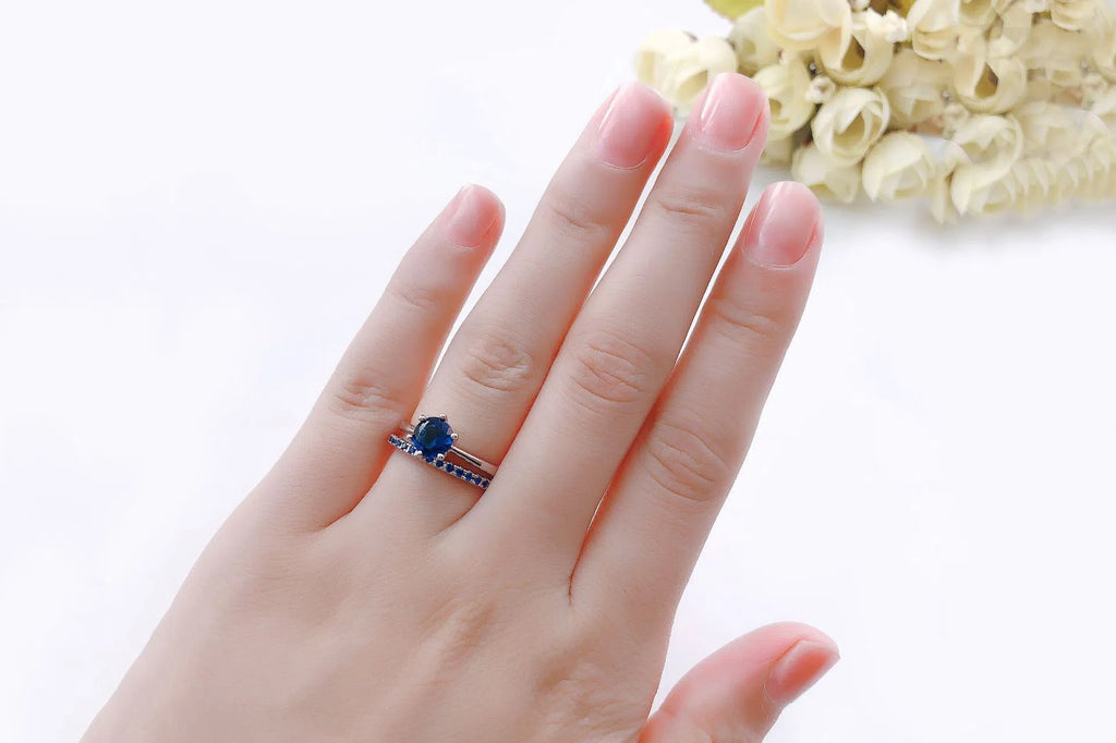 Gold plated copper ring set with two rings, each with a 6mm zircon stone in a six-claw setting, available in three colours.
