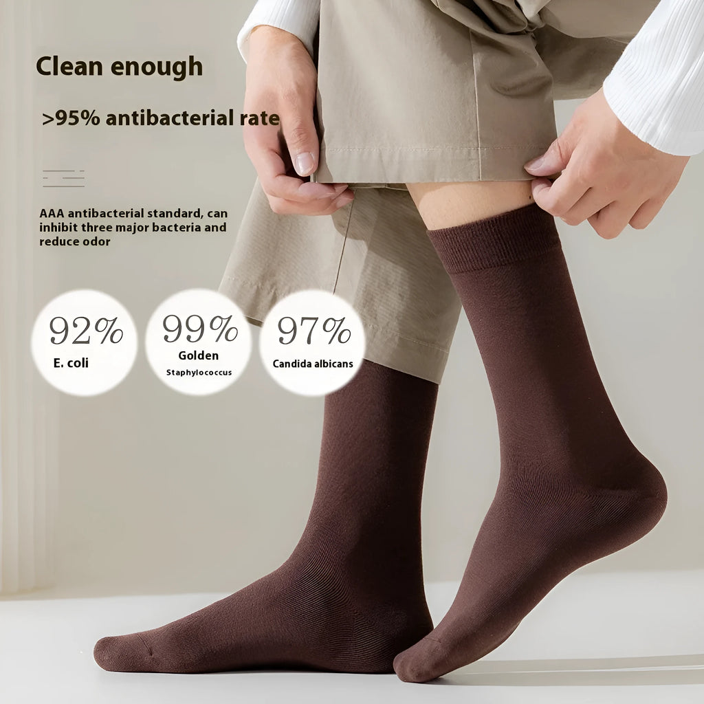 Mid-calf length men's business socks in solid colours, made from pure combed cotton.
