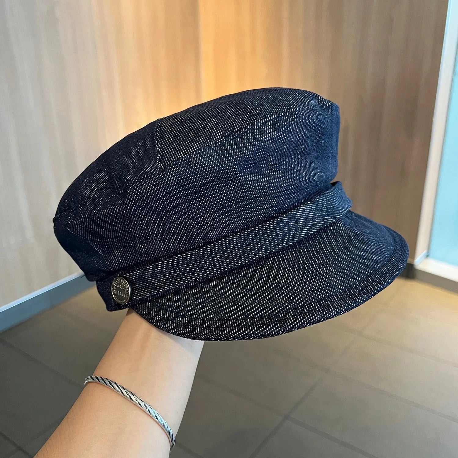 Dark blue denim octagonal newsboy hat with adjustable sizing for 54-58cm head circumference