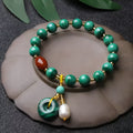 Natural green malachite and red agate barrel bead bracelet on wrist, bead size 7-8mm.