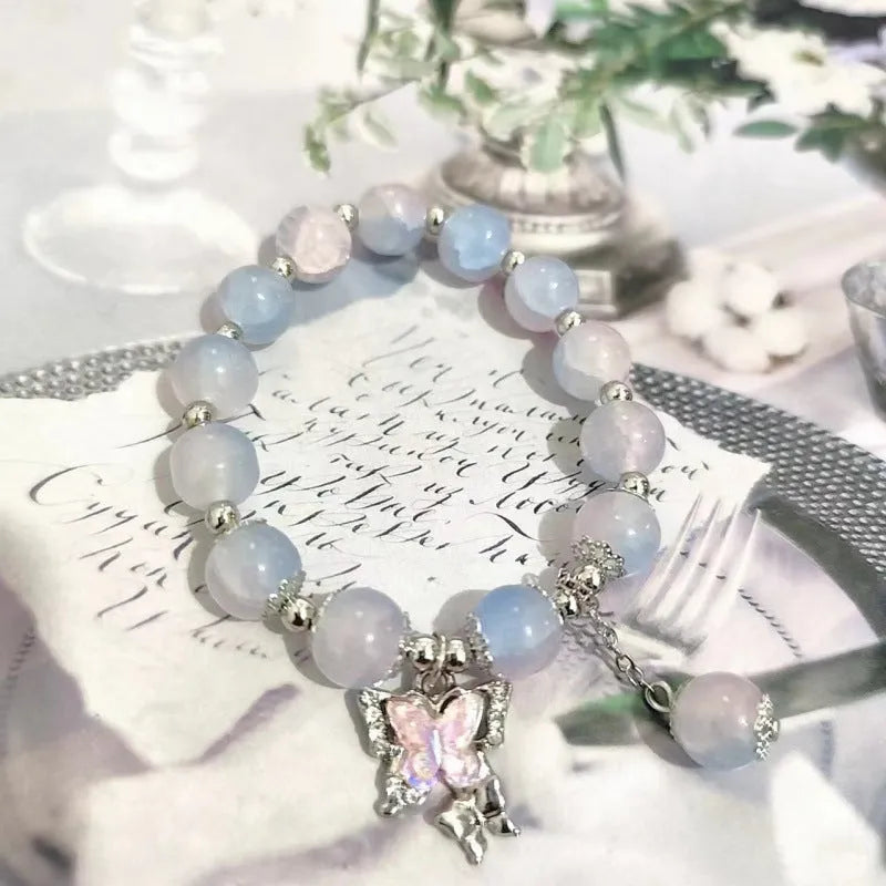 Chinese style glass bead bracelet with bamboo leaf design and manual craftsmanship details.
