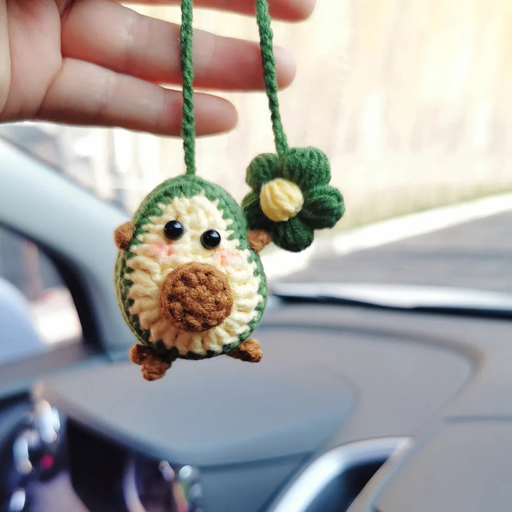 Handmade crocheted wool car pendant with rainbow flower pattern and cartoon avocado design in three colour options