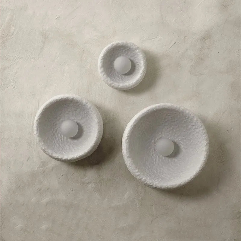 Japanese-style minimalist wall lamp with resin shade in three diameter sizes for modern interiors