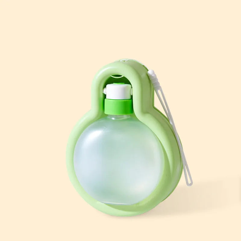 Green portable dog travel water bottle with pull-out bowl, shown with dimensions.