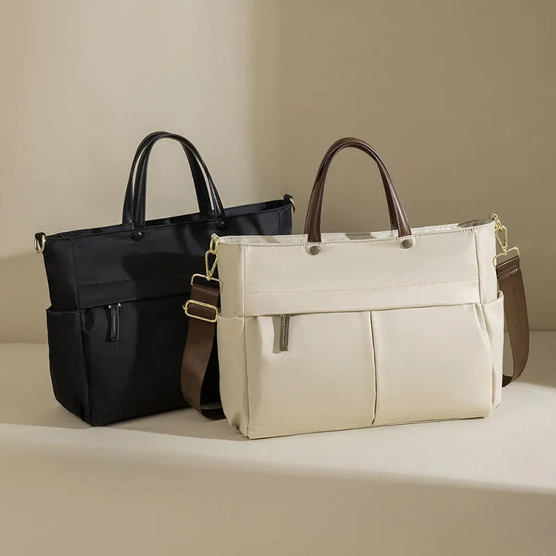 Women's urban simplicity style Oxford cloth laptop briefcase in elegant black with contrast stitching.