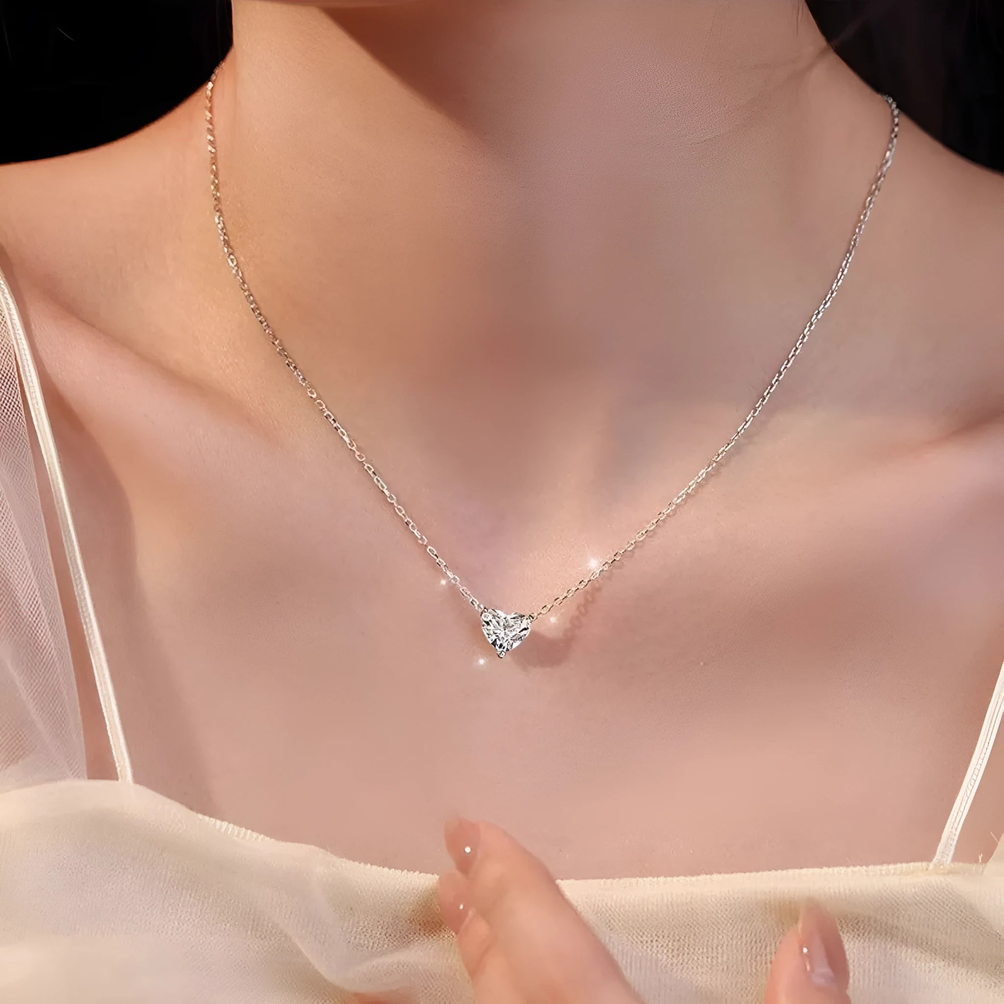 Women's silver heart-shaped love necklace on copper chain with simple refined design