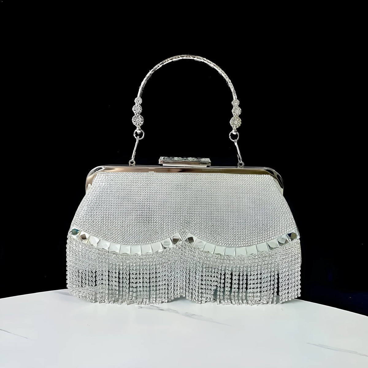 Tassel banquet bag in silver, gold or black polyester with shell shape and chain detail
