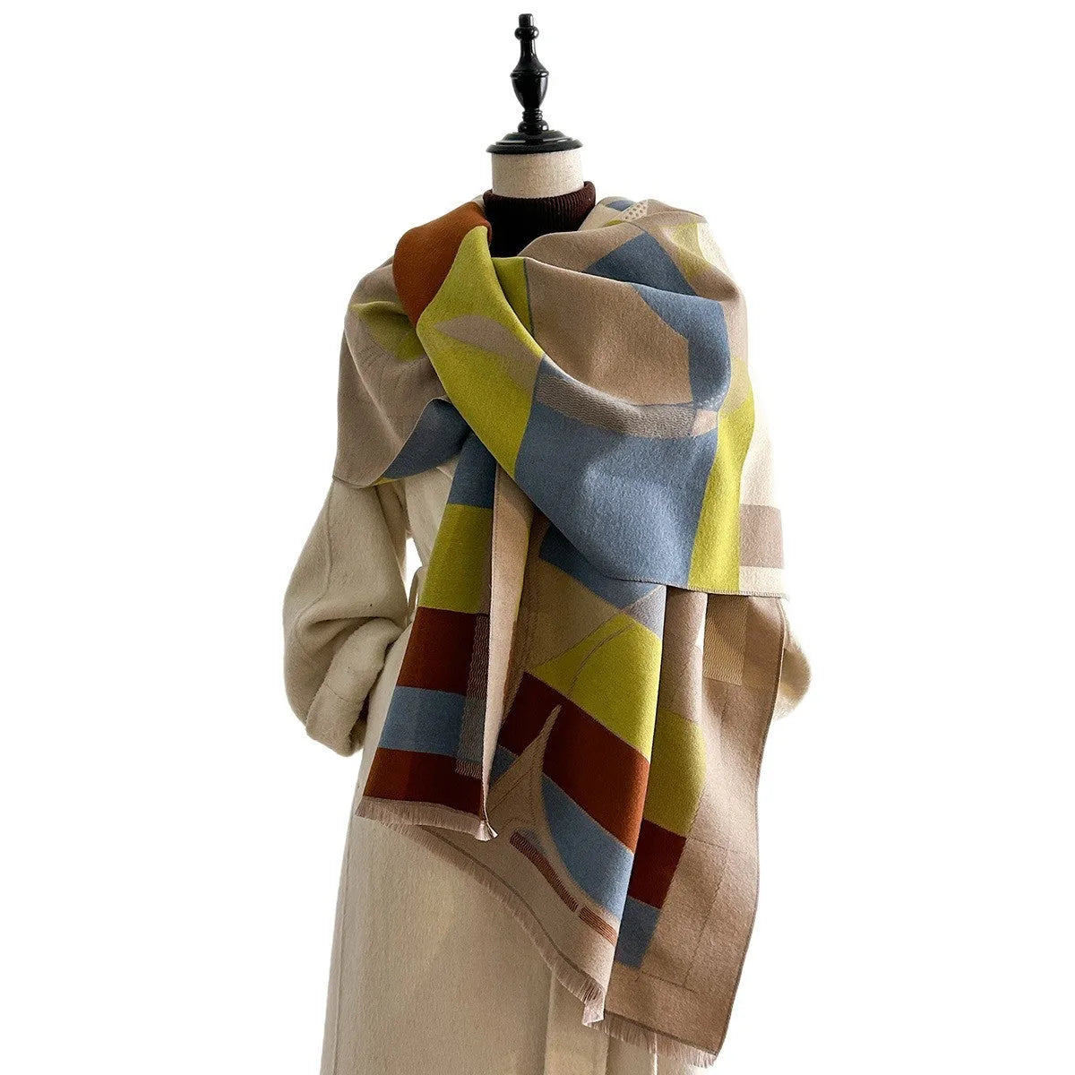 Long beige imitation cashmere style polyester scarf draped to show its 185 cm length and texture.