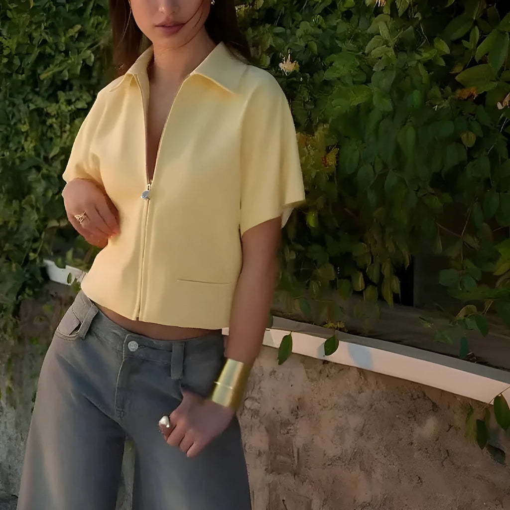 Loose-fit short sleeve casual top in white, shown on a model.