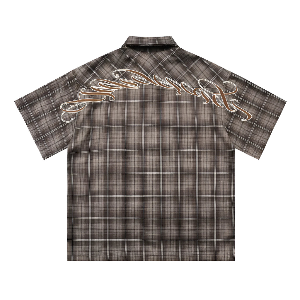 Men's black and brown plaid shirt with embroidered letter detail on chest, short sleeves, lapel collar