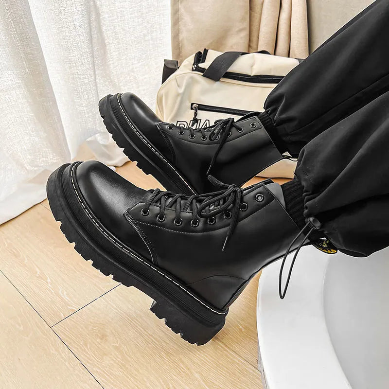 Black Dr. Martens men's platform ankle boots with side zip and fly weave pattern on frosted leather.